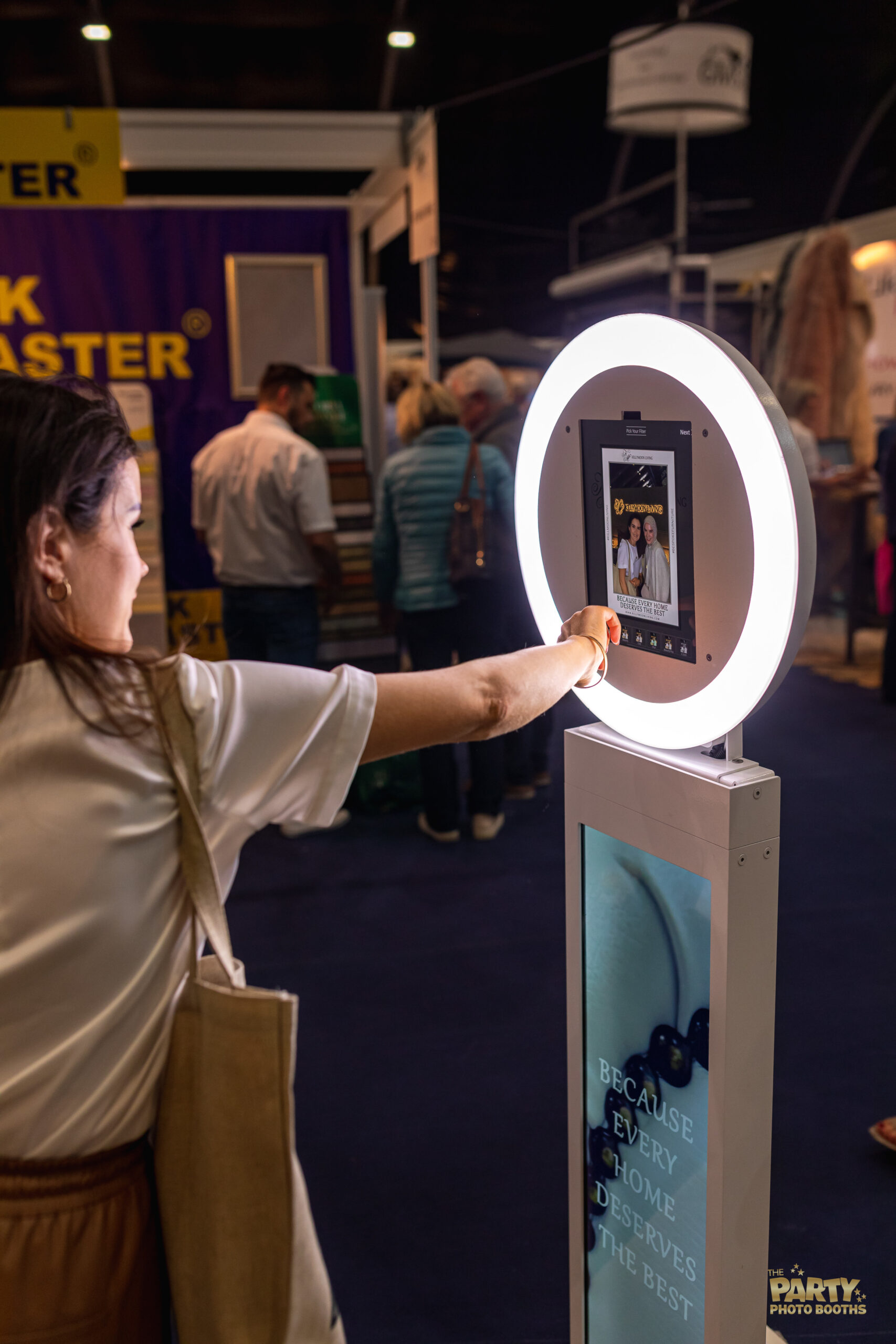 A woman holds a lighted selfie stick